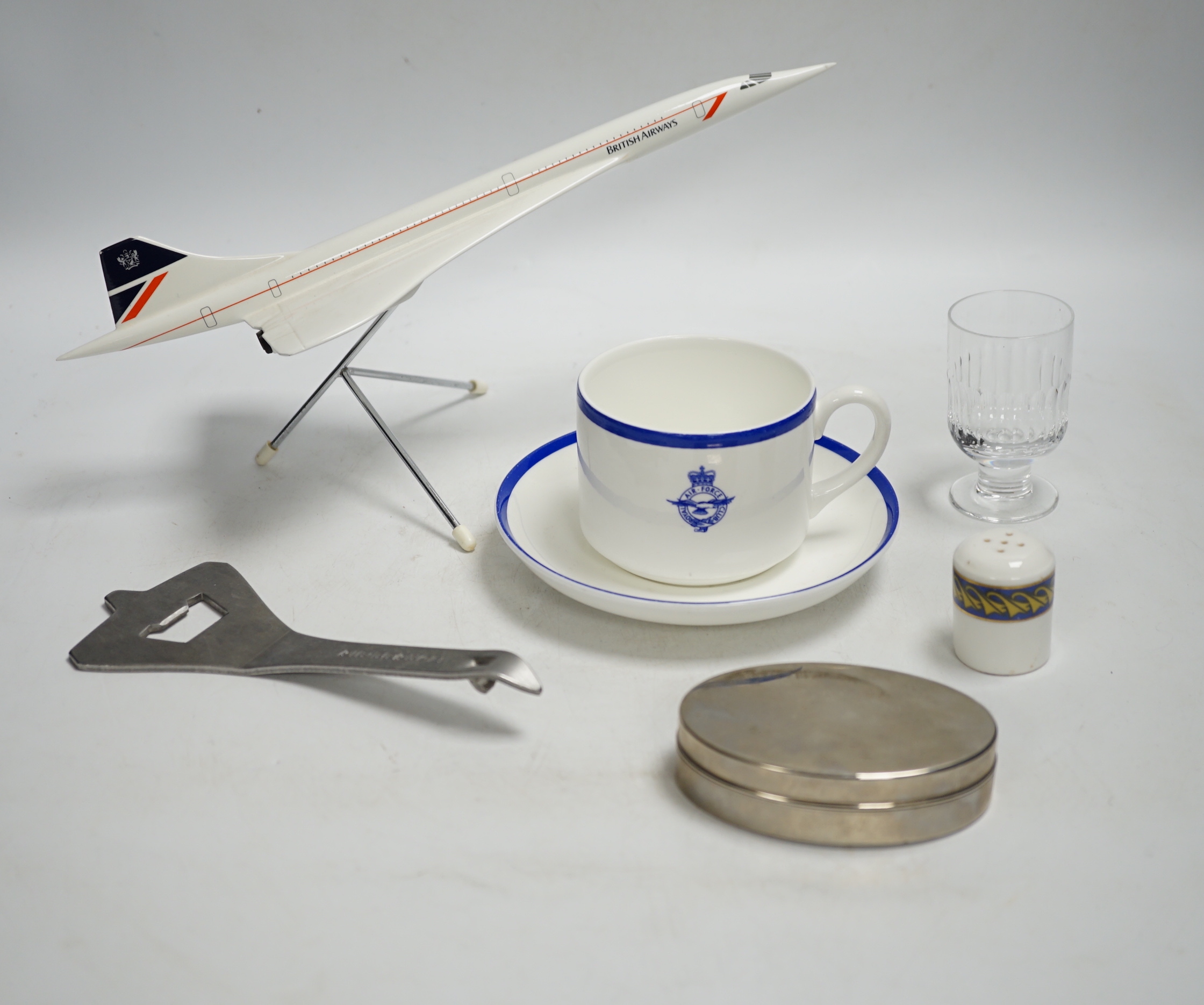 Concorde memorabilia comprising four British Airways glass tots, a pair of plated cased clothes brushes, three graduated scale models of Concorde and a bottle opener together with four Wedgwood Royal Air Force Club mugs